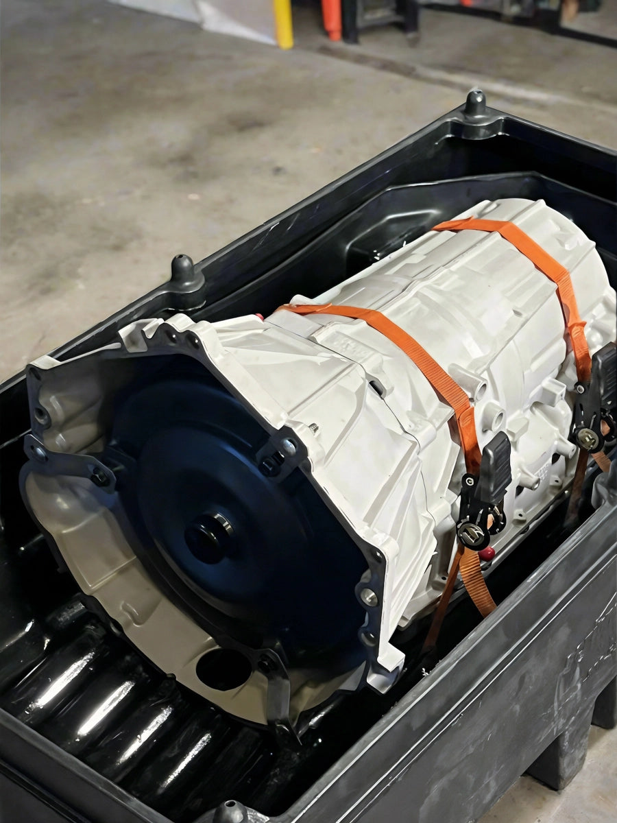 Freshly rebuilt GM 6L80 transmission strapped in Quantum Gear shipping crate, ready for dispatch