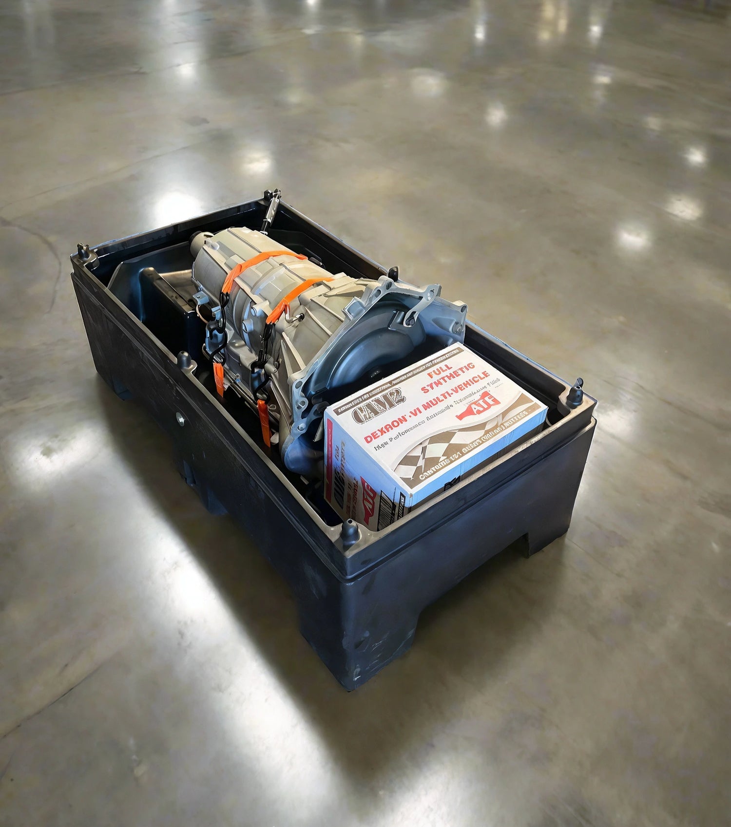 Rebuilt 6L80 transmission by Quantum Gear, professionally packaged with synthetic ATF fluid and secured for shipment.